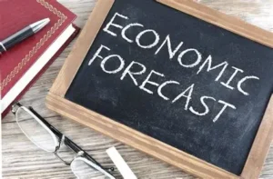 economic forecast written in white chalk on a blackboard