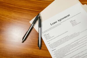 Lease Agreement with two pens on a desk