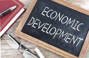 economic development text written on blackboard